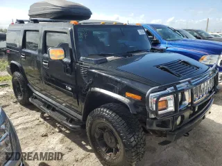 2003 Hummer H2 with VIN 5GRGN23U33H114427, listed as a Copart auction lot 76528834 with 133,571 mi miles and Salvage Title. Bid and sale history available at carsss.com. Image 4.