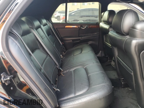 2002 Cadillac DeVille DTS with VIN 1G6KF57962U233811, listed as a Copart auction lot 80435034 with 62,005 mi miles and Salvage Title. Bid and sale history available at carsss.com. Image 10.