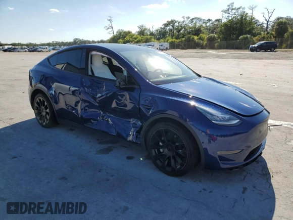 2020 Tesla Model Y Long Range with VIN 5YJYGDEE8LF034719, listed as a Copart auction lot 50888365 with 55,307 mi miles and Salvage Title. Bid and sale history available at DreamBid. Image 4.
