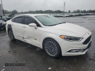 2017 Ford Fusion Titanium z VIN 3FA6P0SUXHR268559, wystawiony jako Copart lot #57456085 z przebiegiem 124 072 mil mil oraz Szkoda całkowita • Salvage title. Historia ofert i sprzedaży dostępna na DreamBid. Obrazek 4.