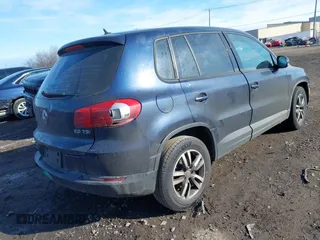 2014 Volkswagen Tiguan SE z VIN WVGAV3AX7EW541355, wystawiony jako IAAI lot #42032798 z przebiegiem 220 940 mil mil oraz . Historia ofert i sprzedaży dostępna na DreamBid. Obrazek 4.