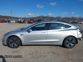 2018 Tesla Model 3 Long Range Battery with VIN 5YJ3E1EB9JF065057, listed as a IAAI auction lot 41863903 with 54,584 mi miles and . Bid and sale history available at DreamBid. Image 14.
