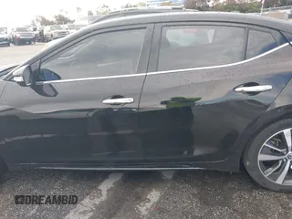 2020 Nissan Maxima SV z VIN 1N4AA6CV3LC369536, wystawiony jako IAAI lot #41793232 z przebiegiem 91 483 mil mil oraz . Historia ofert i sprzedaży dostępna na DreamBid. Obrazek 13.