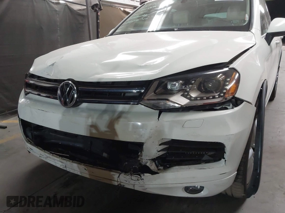 2012 Volkswagen Touareg Sport with VIN WVGFK9BP2CD002991, listed as a IAAI auction lot 42077523 with 94,515 mi miles and . Bid and sale history available at DreamBid. Image 6.