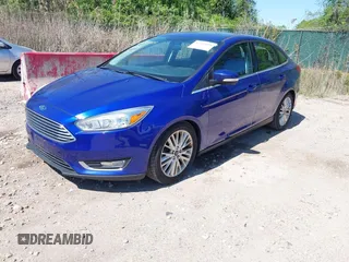 2015 Ford Focus Titanium with VIN 1FADP3J20FL304828, listed as a IAAI auction lot 42144101 with 199,715 mi miles and . Bid and sale history available at carsss.com. Image 2.