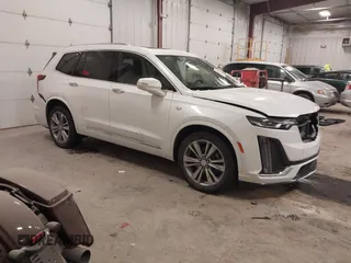 2023 Cadillac XT6 AWD Premium Luxury with VIN 1GYKPDRS3PZ198461, listed as a IAAI auction lot 41317726 with 48,991 mi miles and . Bid and sale history available at DreamBid. Image 1.