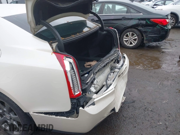 2014 Cadillac ATS Luxury AWD z VIN 1G6AH5RX1E0147092, wystawiony jako IAAI lot #40321476 z przebiegiem 115 224 mil mil oraz . Historia ofert i sprzedaży dostępna na DreamBid. Obrazek 6.