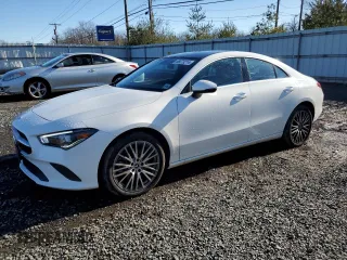 2021 Mercedes-Benz CLA with VIN W1K5J4HBXMN199220, listed as a Copart auction lot 86673214 with 29,801 mi miles and Salvage Title. Bid and sale history available at carsss.com. Image 1.