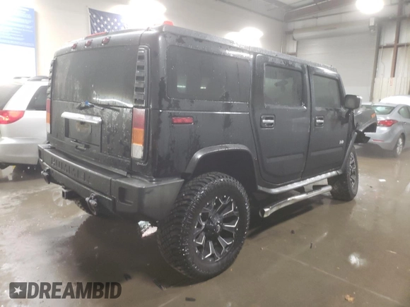2003 Hummer H2 with VIN 5GRGN23U33H143023, listed as a Copart auction lot 84403414 with 0 mi miles and Salvage Title. Bid and sale history available at carsss.com. Image 3.