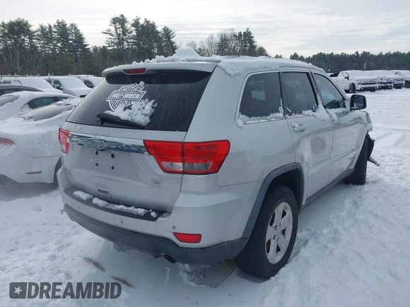 2011 Jeep Grand Cherokee 70th Anniversary with VIN 1J4RR4GGXBC609633, listed as a IAAI auction lot 41469526 with 138,439 mi miles. Bid and sale history available at carsss.com. Image 4.