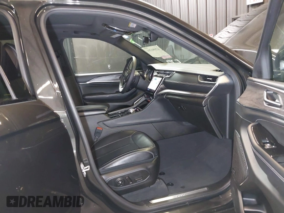 2023 Jeep Grand Cherokee Overland with VIN 1C4RJHDG0P8701157, listed as a IAAI auction lot 42080201 with 24,709 mi miles and . Bid and sale history available at DreamBid. Image 5.