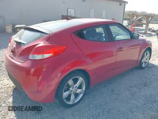 2014 Hyundai Veloster with VIN KMHTC6AD2EU214847, listed as a IAAI auction lot 42067728 with 77,421 mi miles. Bid and sale history available at carsss.com. Image 4.