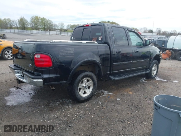 2002 Ford F-150 XLT with VIN 1FTRW08L32KD90202, listed as a IAAI auction lot 41850546 with 256,807 mi miles. Bid and sale history available at carsss.com. Image 4.