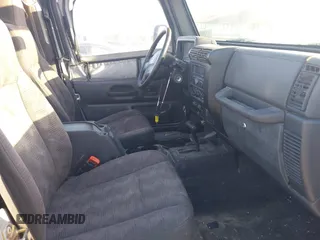 2005 Jeep Wrangler X with VIN 1J4FA39S55P348432, listed as a IAAI auction lot 41868451 with 166,876 mi miles. Bid and sale history available at carsss.com. Image 5.