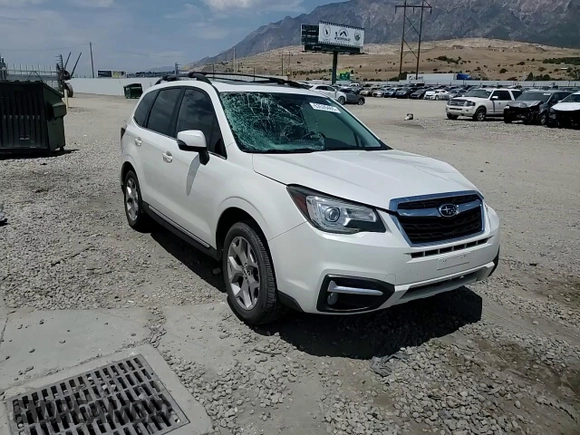 2018 Subaru Forester Touring with VIN JF2SJAWC4JH435749, listed as a Copart auction lot 63526465 with 143,029 mi miles and Salvage title. Bid and sale history available at DreamBid. Image 14.