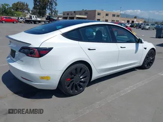 2022 Tesla Model 3 Performance with VIN 5YJ3E1ECXNF270238, listed as a IAAI auction lot 42173668 with 13,017 mi miles and . Bid and sale history available at DreamBid. Image 4.