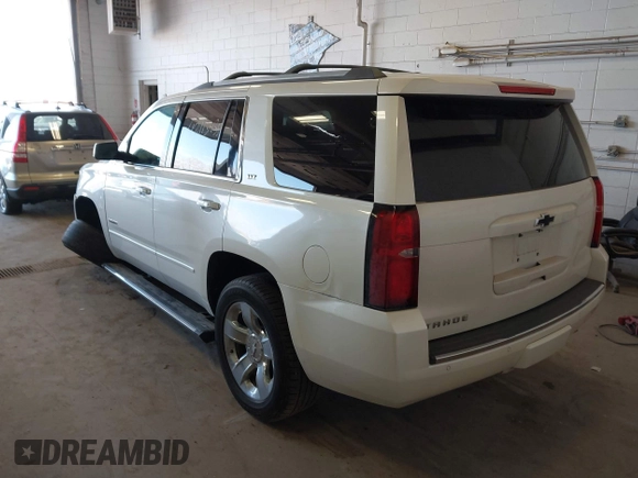 2015 Chevrolet Tahoe LTZ with VIN 1GNSKCKC9FR123996, listed as a IAAI auction lot 42113435 with 149,825 mi miles and . Bid and sale history available at DreamBid. Image 3.