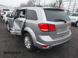 2016 Dodge Journey SXT with VIN 3C4PDDBG2GT242127, listed as a IAAI auction lot 41485555 with 119,728 mi miles. Bid and sale history available at carsss.com. Image 3.