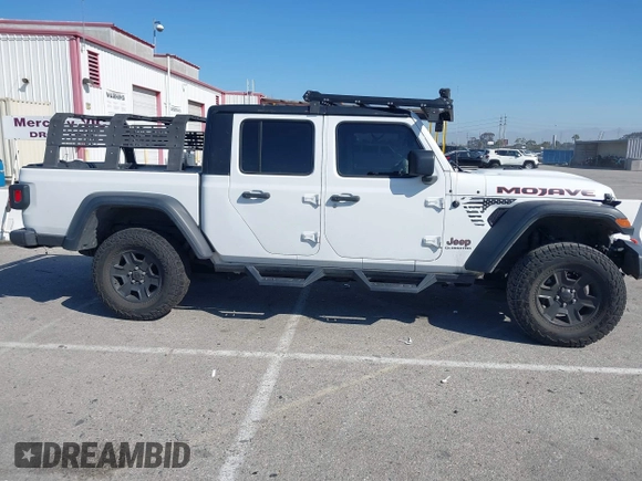 2022 Jeep Gladiator Mojave z VIN 1C6JJTEG0NL103523, wystawiony jako IAAI lot #41842011 z przebiegiem 36 160 mil mil oraz . Historia ofert i sprzedaży dostępna na DreamBid. Obrazek 14.