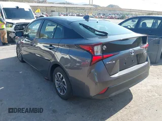 2021 Toyota Prius L Eco with VIN JTDKAMFU4M3144985, listed as a IAAI auction lot 42443957 with 20,816 mi miles and . Bid and sale history available at DreamBid. Image 3.
