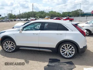2019 Cadillac XT4 AWD Premium Luxury z VIN 1GYFZDR48KF131619, wystawiony jako IAAI lot #42202281 z przebiegiem 67 048 mil mil oraz . Historia ofert i sprzedaży dostępna na DreamBid. Obrazek 14.