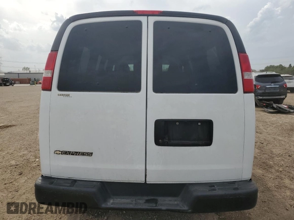 2018 Chevrolet Express Passenger LS with VIN 1GAWGEFG0J1212151, listed as a Copart auction lot 57289585 with 138,956 mi miles and Salvage title. Bid and sale history available at DreamBid. Image 6.