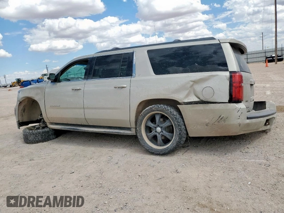 2015 Chevrolet Suburban LT with VIN 1GNSCJKC0FR153454, listed as a Copart auction lot 62672615 with 184,498 mi miles and Salvage title. Bid and sale history available at DreamBid. Image 2.