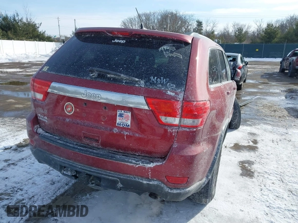 2013 Jeep Grand Cherokee Laredo with VIN 1C4RJFAG4DC572986, listed as a IAAI auction lot 41586820 with 100,899 mi miles. Bid and sale history available at carsss.com. Image 4.