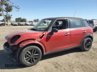 2014 MINI Countryman with VIN WMWZB3C5XEWR42035, listed as a Copart auction lot 61846725 with 105,131 mi miles and Salvage title. Bid and sale history available at DreamBid. Image 1.