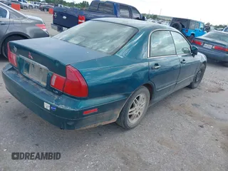 2001 Mitsubishi Diamante LS z VIN 6MMAP67P51T007599, wystawiony jako IAAI lot #42425149 z przebiegiem 115 132 mil mil oraz . Historia ofert i sprzedaży dostępna na DreamBid. Obrazek 4.