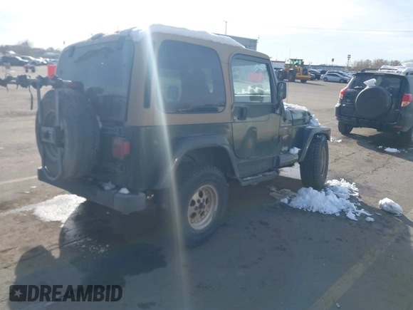 1998 Jeep Wrangler Sahara z VIN 1J4FY49S3WP744619, wystawiony jako IAAI lot #41107702 z przebiegiem 105 432 mil mil oraz . Historia ofert i sprzedaży dostępna na DreamBid. Obrazek 4.