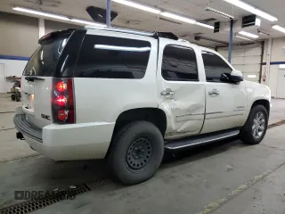 2014 GMC Yukon Denali with VIN 1GKS2EEF6ER141112, listed as a Copart auction lot 88526685 with 142,248 mi miles and Salvage Title. Bid and sale history available at carsss.com. Image 3.
