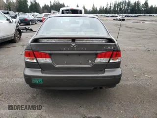 2000 Infiniti G20 Luxury z VIN JNKCP11A5YT303404, wystawiony jako Copart lot #82801234 z przebiegiem 178 185 mil mil oraz Tytuł czysty. Historia ofert i sprzedaży dostępna na DreamBid. Obrazek 6.