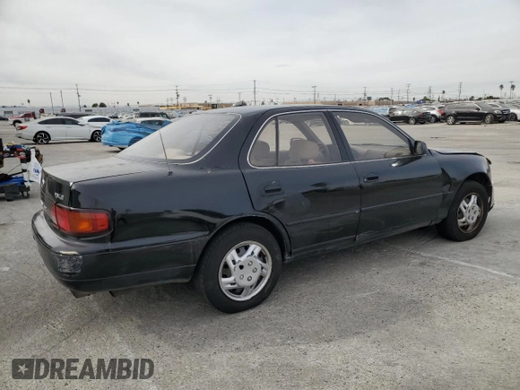 1995 Toyota Camry LE with VIN JT2GK12E2S0079545, listed as a Copart auction lot 84058164 with 150,539 mi miles and Salvage Title. Bid and sale history available at carsss.com. Image 3.