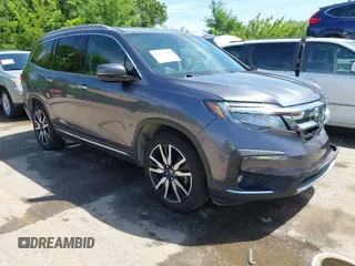 2021 Honda Pilot Touring 7-Passenger with VIN 5FNYF6H66MB081767, listed as a IAAI auction lot 42221152 with 74,029 mi miles and . Bid and sale history available at DreamBid. Image 1.