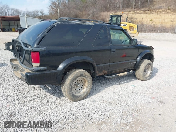 2000 Chevrolet Blazer LS z VIN 1GNCT18W1YK112722, wystawiony jako IAAI lot #41758275 z przebiegiem 157 730 mil mil oraz . Historia ofert i sprzedaży dostępna na DreamBid. Obrazek 4.