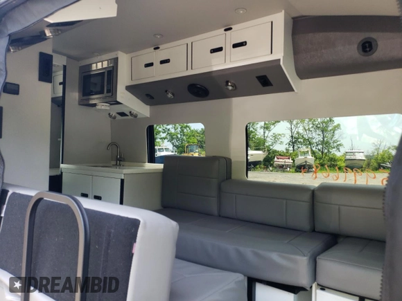 2022 Ford Transit with VIN 1FDRU8UG5NKA33889, listed as a Copart auction lot 55999664 with 23,149 mi miles and Salvage Title. Bid and sale history available at DreamBid. Image 11.