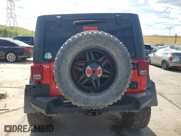 2018 Jeep Wrangler JK Unlimited Sport S with VIN 1C4HJWDG4JL898662, listed as a Copart auction lot 69213864 with 52,773 mi miles and Salvage Title. Bid and sale history available at carsss.com. Image 6.