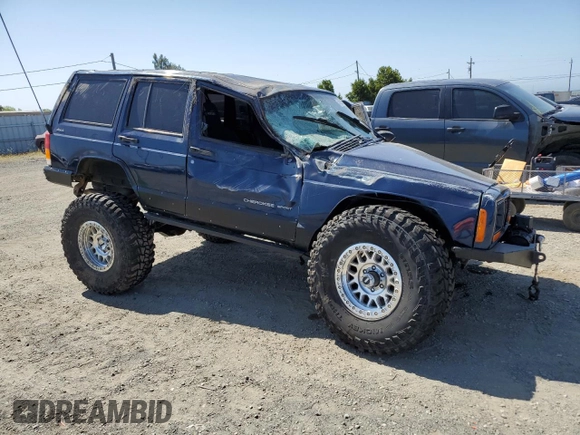 2000 Jeep Cherokee with VIN 1J4FF48S3YL126931, listed as a Copart auction lot 57593305 with Not provided miles and Non repairable. Bid and sale history available at DreamBid. Image 4.