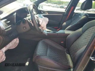 2023 Genesis G70 3.3T with VIN KMTG54TE3PU117672, listed as a Copart auction lot 63418684 with 19,899 mi miles and Salvage Title. Bid and sale history available at carsss.com. Image 7.
