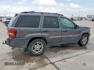 2003 Jeep Grand Cherokee Laredo with VIN 1J4GW48SX3C569087, listed as a Copart auction lot 55941035 with Not provided miles and Salvage title. Bid and sale history available at DreamBid. Image 3.