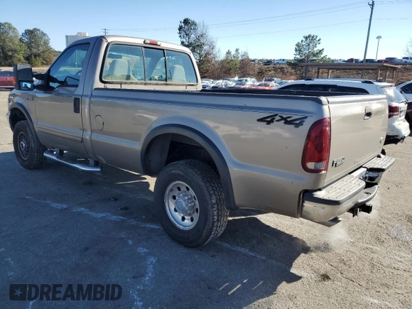 2002 Ford F-250 XL with VIN 1FTNF21L02EA83007, listed as a Copart auction lot 87880345 with 104,889 mi miles and Salvage title. Bid and sale history available at DreamBid. Image 2.