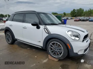 2015 MINI Countryman S with VIN WMWZC5C58FWP46931, listed as a Copart auction lot 59183495 with 105,731 mi miles and Salvage title. Bid and sale history available at DreamBid. Image 4.