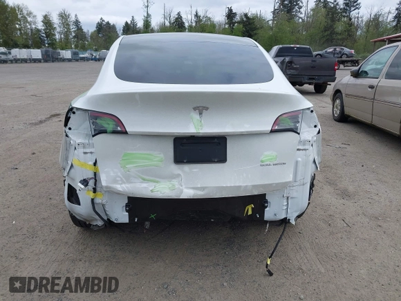 2021 Tesla Model Y Long Range with VIN 5YJYGDEE6MF082883, listed as a IAAI auction lot 42078807 with 64,953 mi miles. Bid and sale history available at carsss.com. Image 6.
