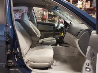 2004 Kia Spectra LX with VIN KNAFE121145012249, listed as a IAAI auction lot 42032571 with 146,748 mi miles. Bid and sale history available at carsss.com. Image 5.