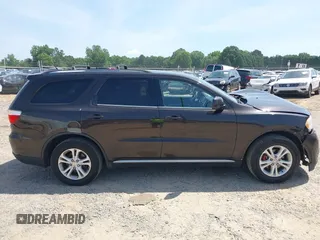 2013 Dodge Durango SXT with VIN 1C4RDJAG7DC580249, listed as a IAAI auction lot 42535723 with 199,626 mi miles and . Bid and sale history available at DreamBid. Image 13.