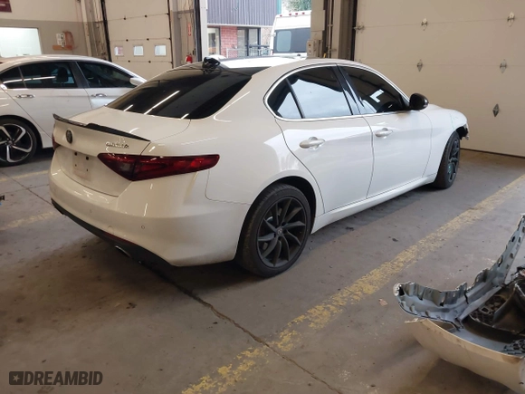 2017 Alfa Romeo Giulia with VIN ZARFAEDN1H7552738, listed as a IAAI auction lot 41529238 with 107,421 mi miles. Bid and sale history available at carsss.com. Image 4.