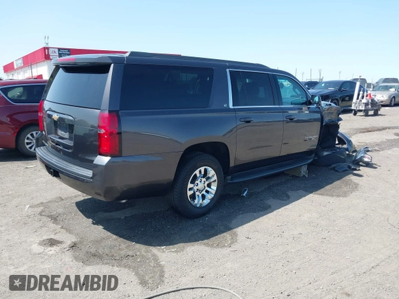 2018 Chevrolet Suburban LT z VIN 1GNSCHKCXJR128787, wystawiony jako IAAI lot #41909965 z przebiegiem 123 020 mil mil oraz . Historia ofert i sprzedaży dostępna na DreamBid. Obrazek 4.