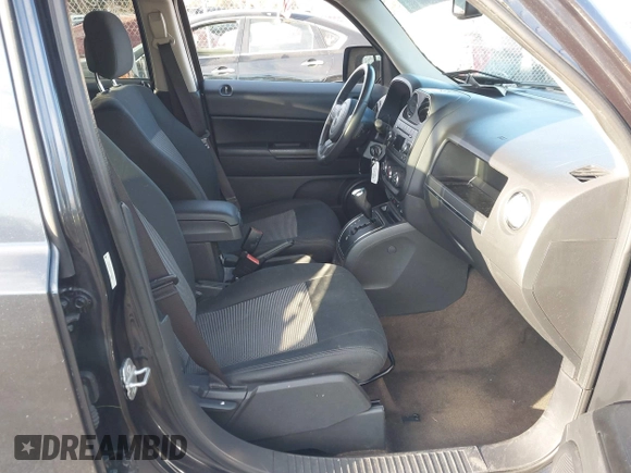 2014 Jeep Patriot Latitude with VIN 1C4NJRFB4ED720241, listed as a IAAI auction lot 40914199 with 128,218 mi miles. Bid and sale history available at carsss.com. Image 5.