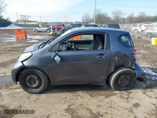 2013 Scion iQ with VIN JTNJJXB00DJ025113, listed as a IAAI auction lot 41503756 with 105,557 mi miles. Bid and sale history available at carsss.com. Image 13.
